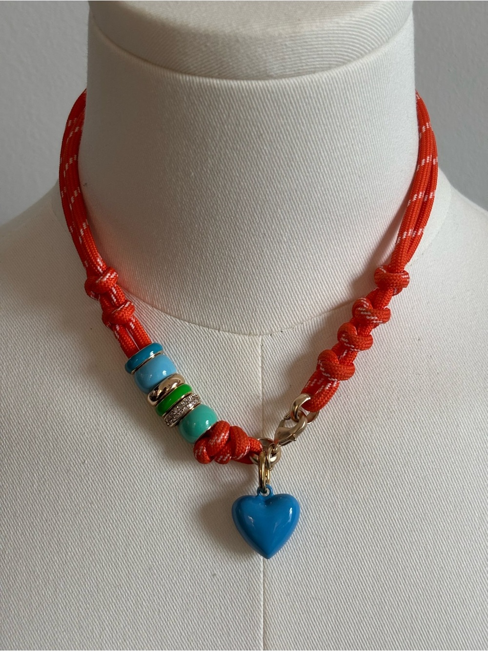 Roxanne Assoulin Orange Rope Necklace with Blue Heart Pendant